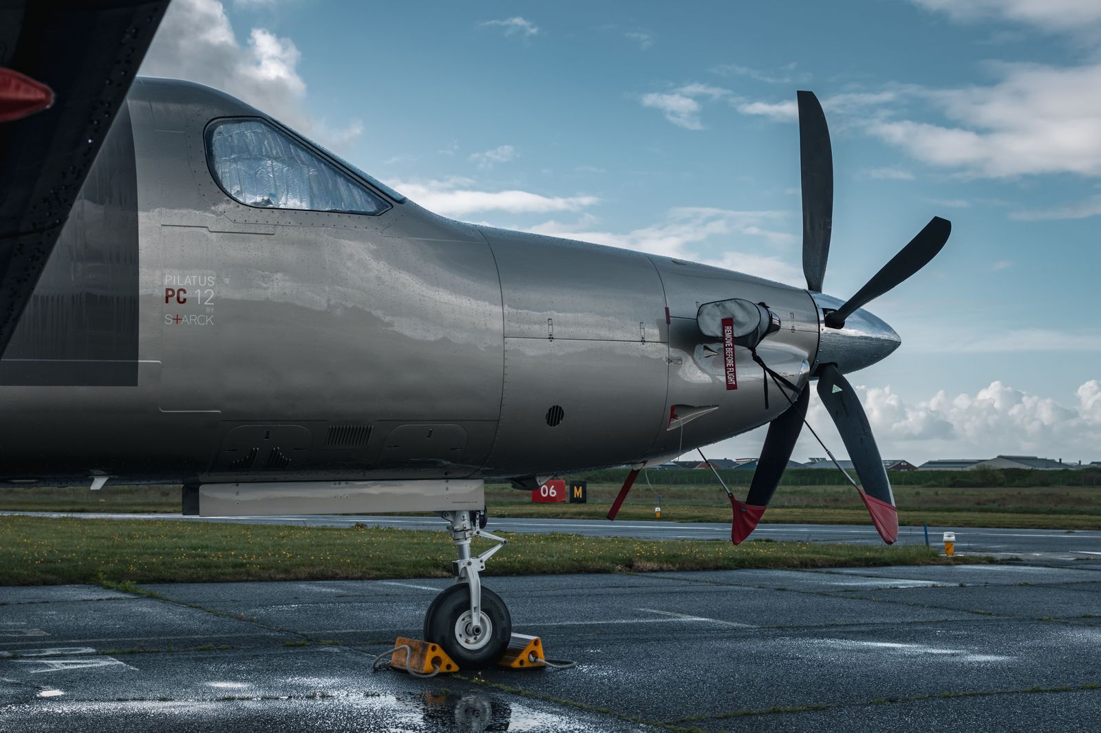 A turboprop aircraft on a runway beside the lake, typical of flights at Billy Bishop