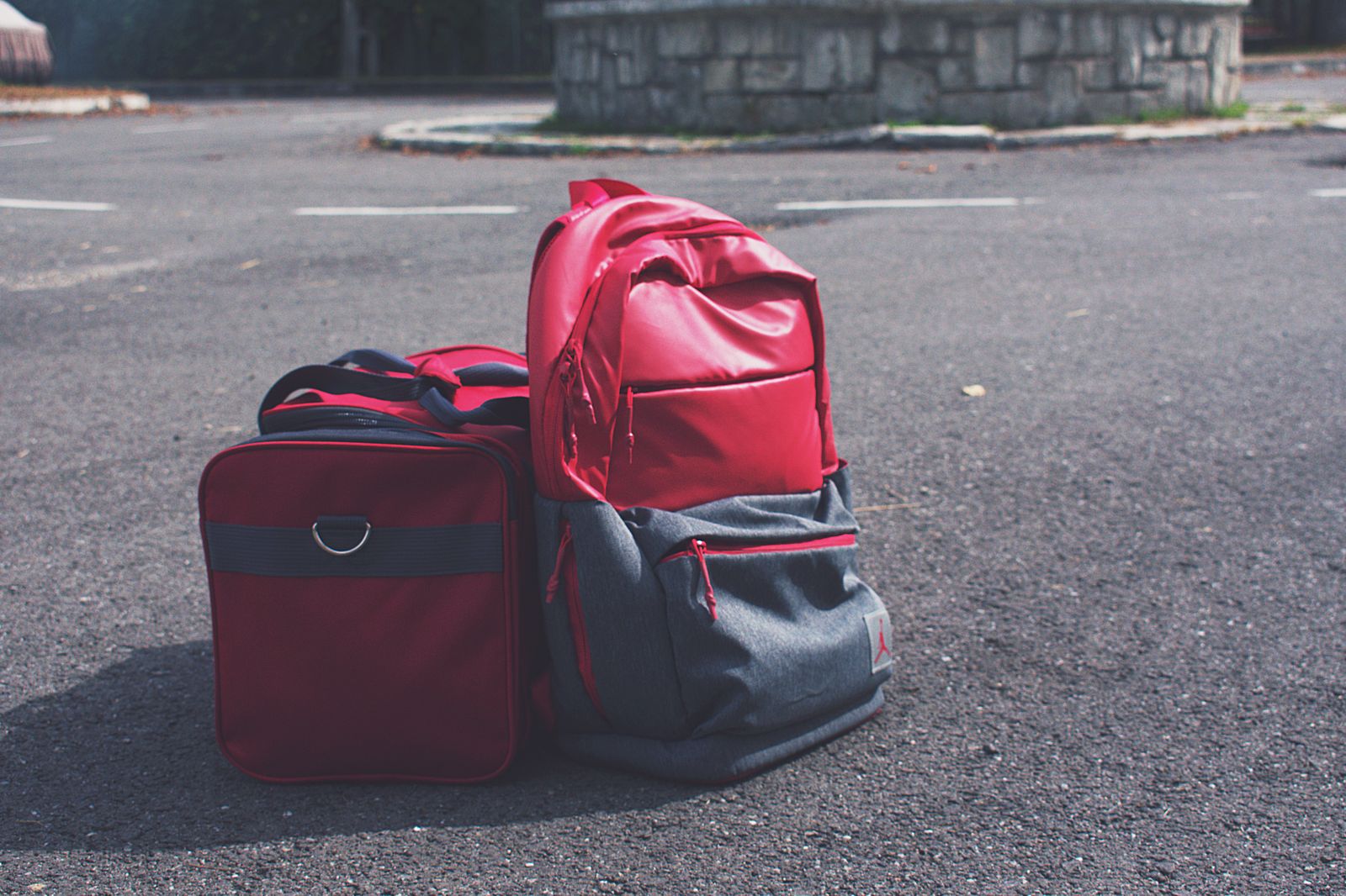 Student with a backpack and suitcase in an airport terminal