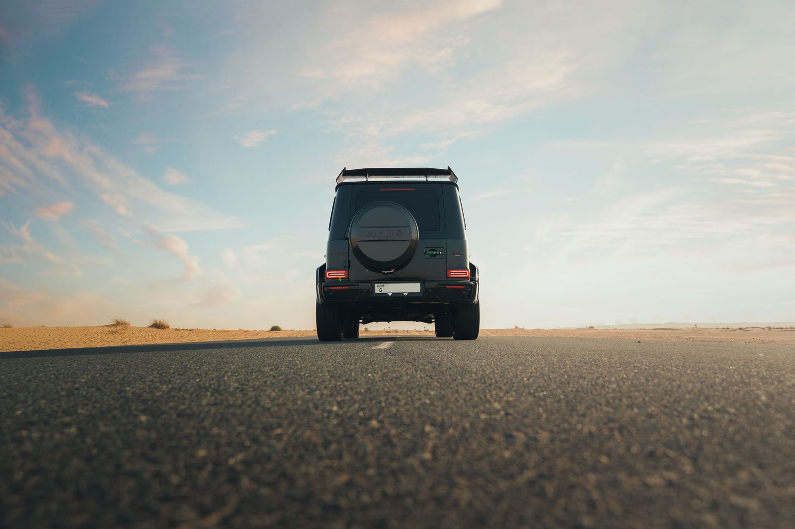 Black SUV on a highway heading away from Pearson after a Dubai arrival