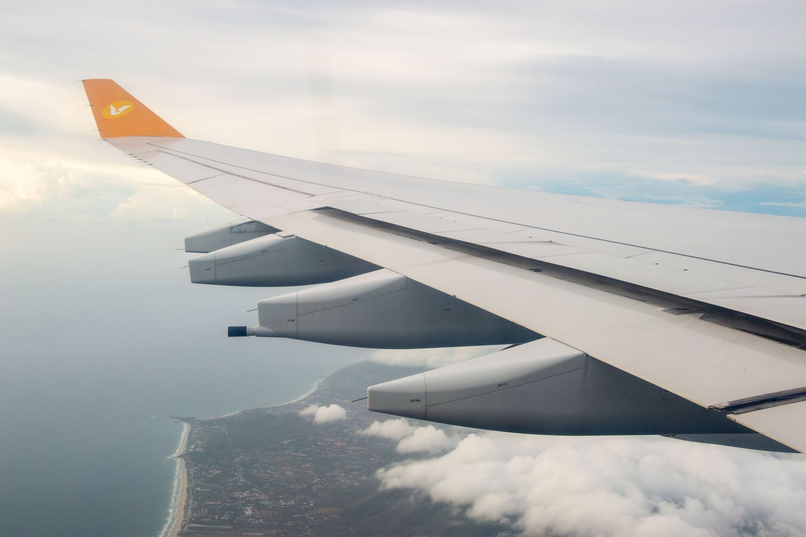 View from an aircraft window over clouds on a transatlantic crossing