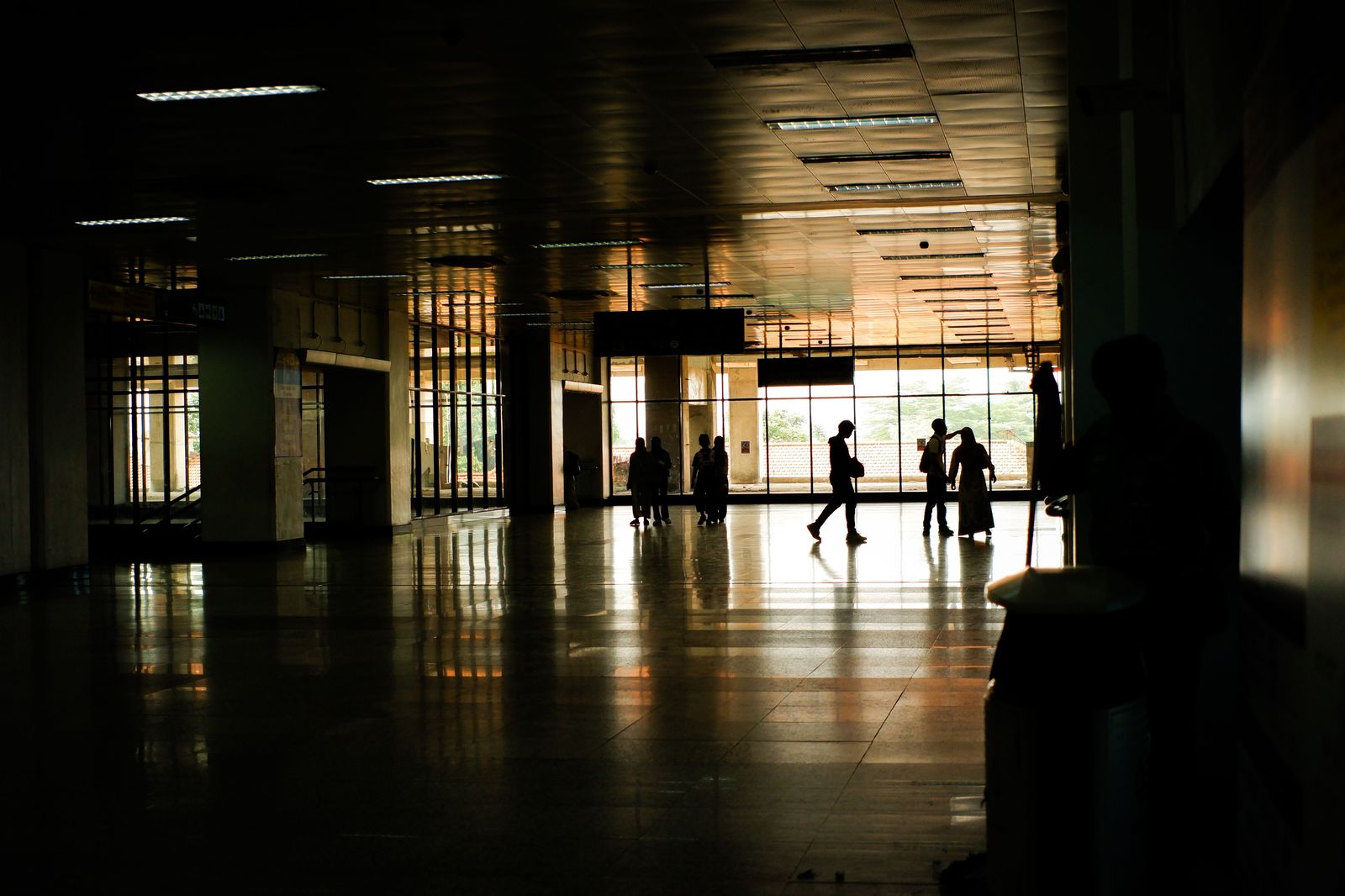 Passengers walking through an airport arrivals hall after an international flight