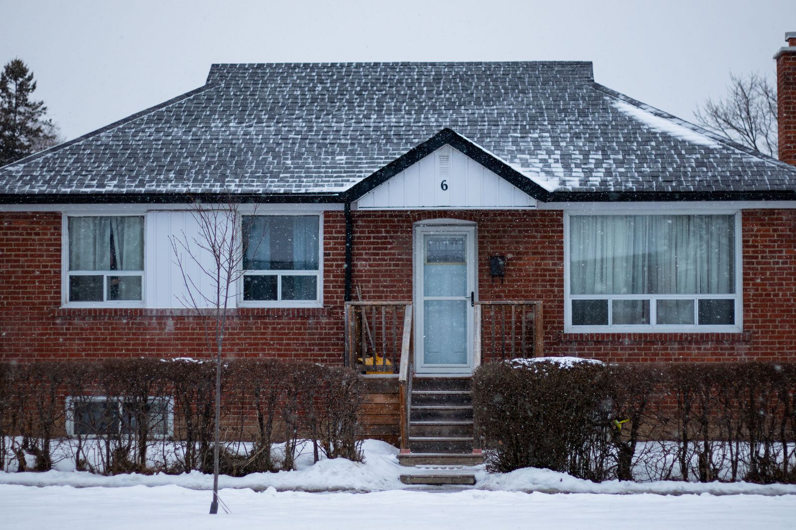 A snowy suburban street in winter