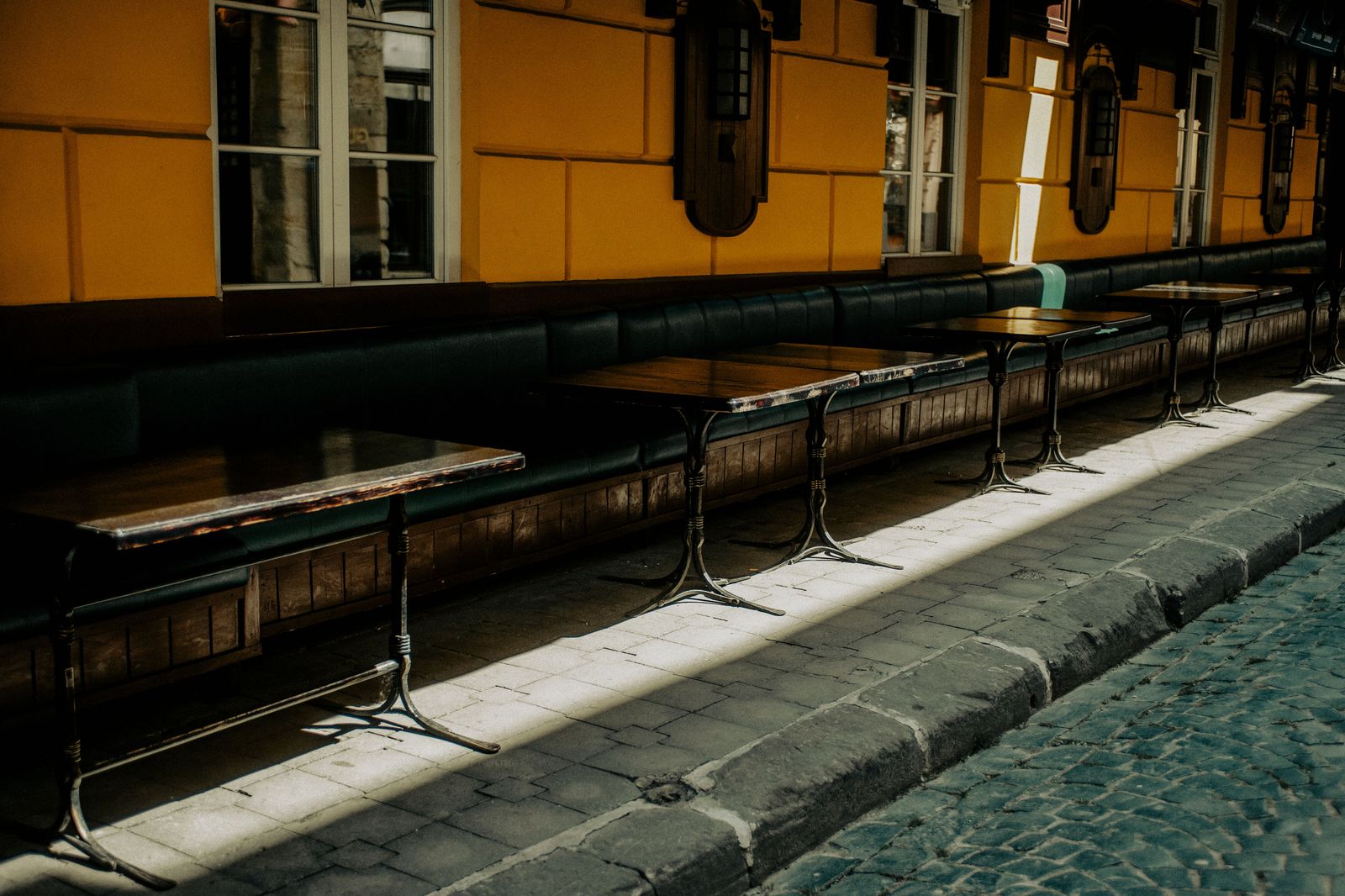 Patios on the cobblestones fill from spring to early autumn