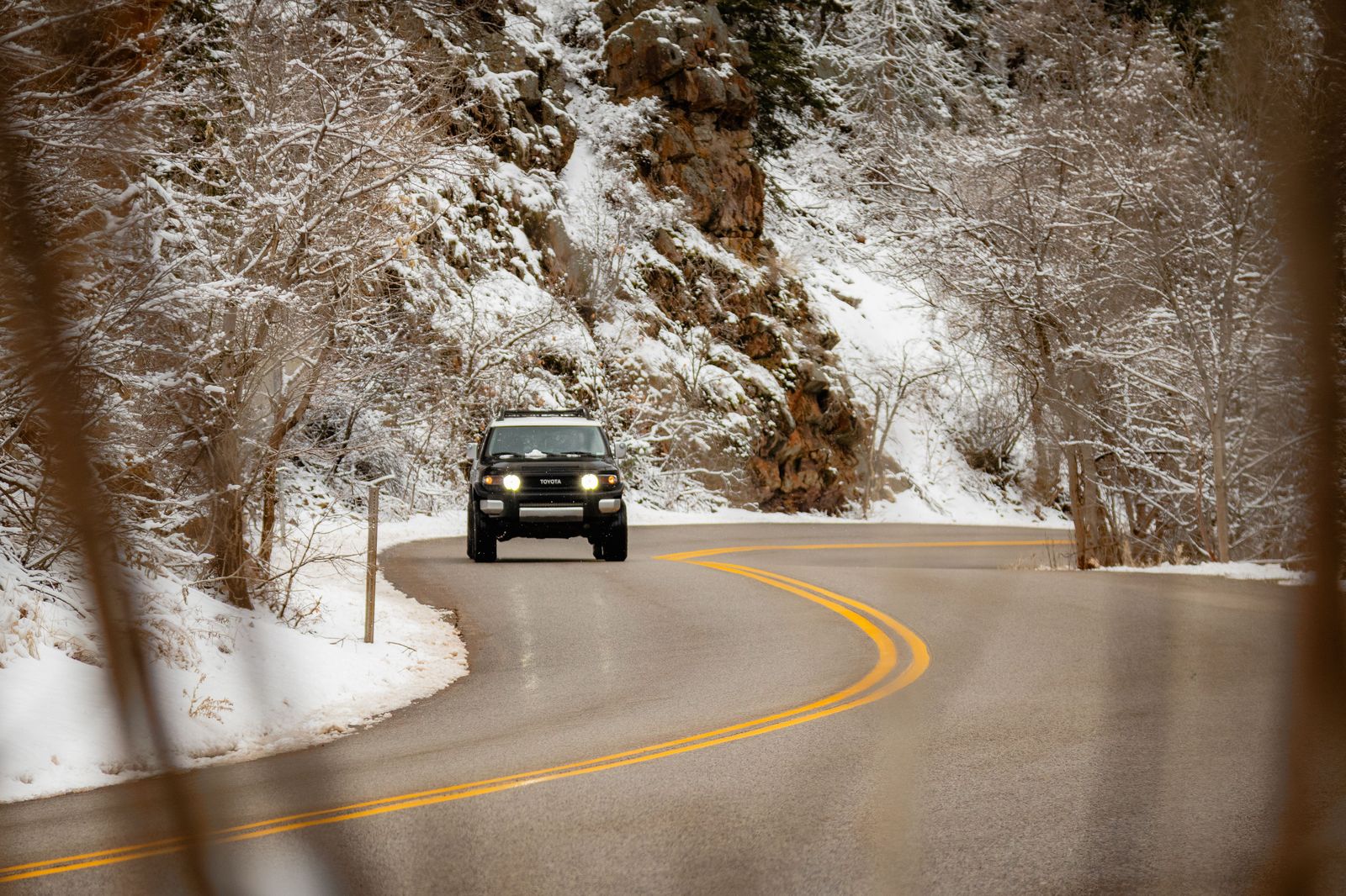 An SUV on a snow-covered highway north of Barrie - winter tires and patience on every ski run