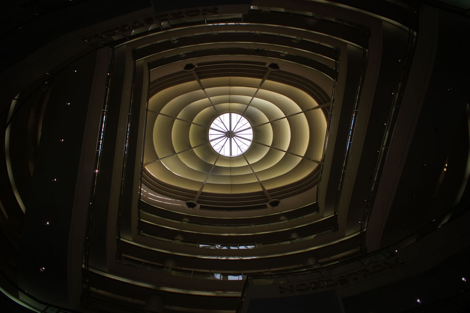 The glass-roofed galleria style of Toronto's big downtown mall - loud, bright and busy on Saturdays