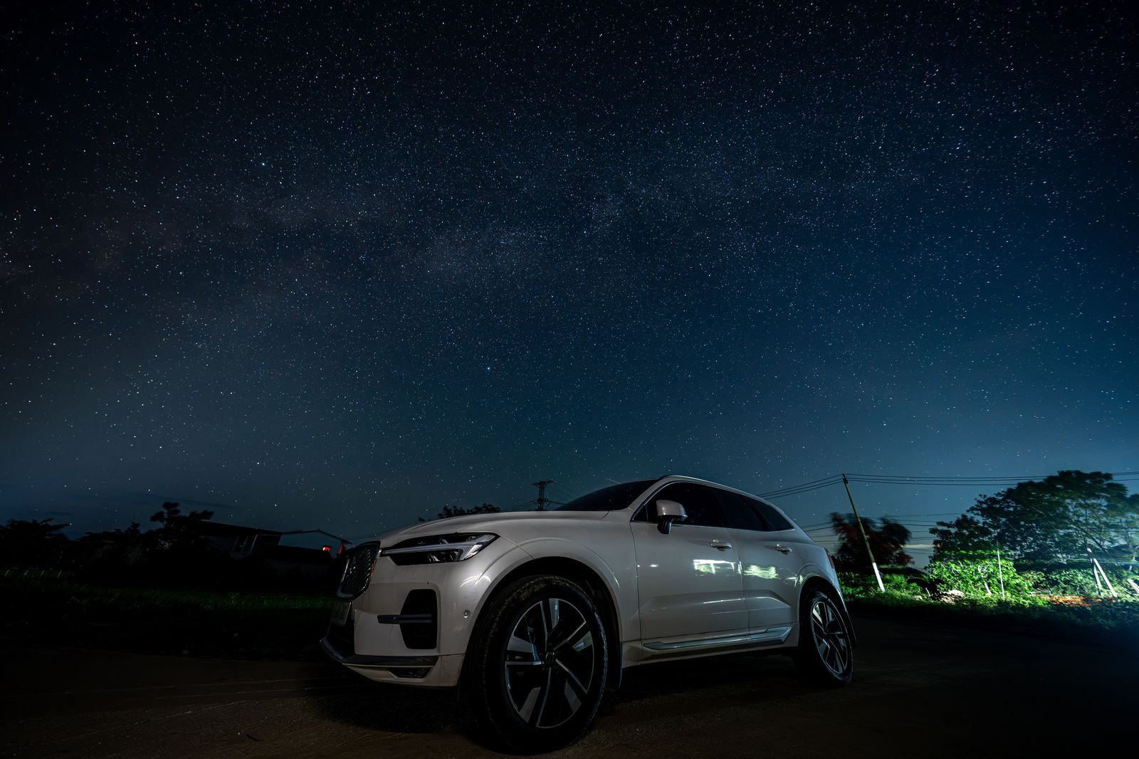 An executive SUV on a highway at night, the usual vehicle for a Durham family airport run