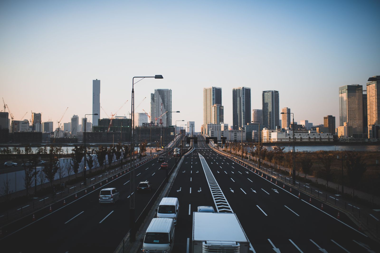 The Gardiner Expressway approaching downtown with the CN Tower ahead at dusk
