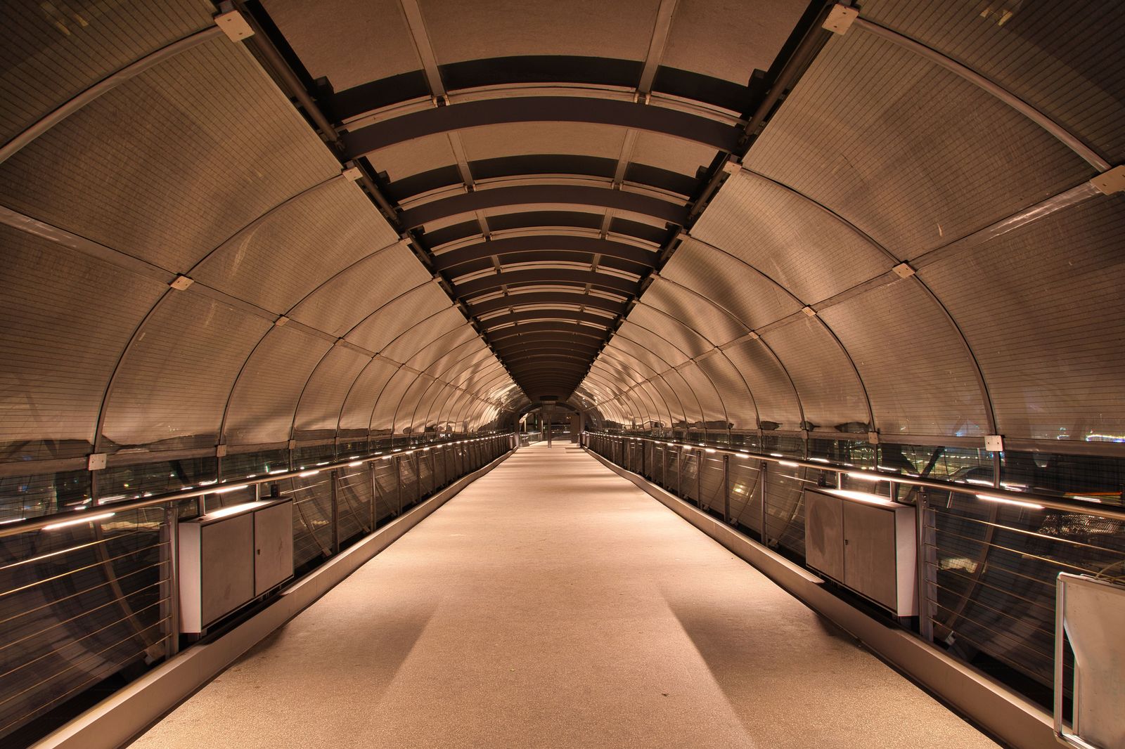 A quiet airport terminal late at night after the last flights have landed