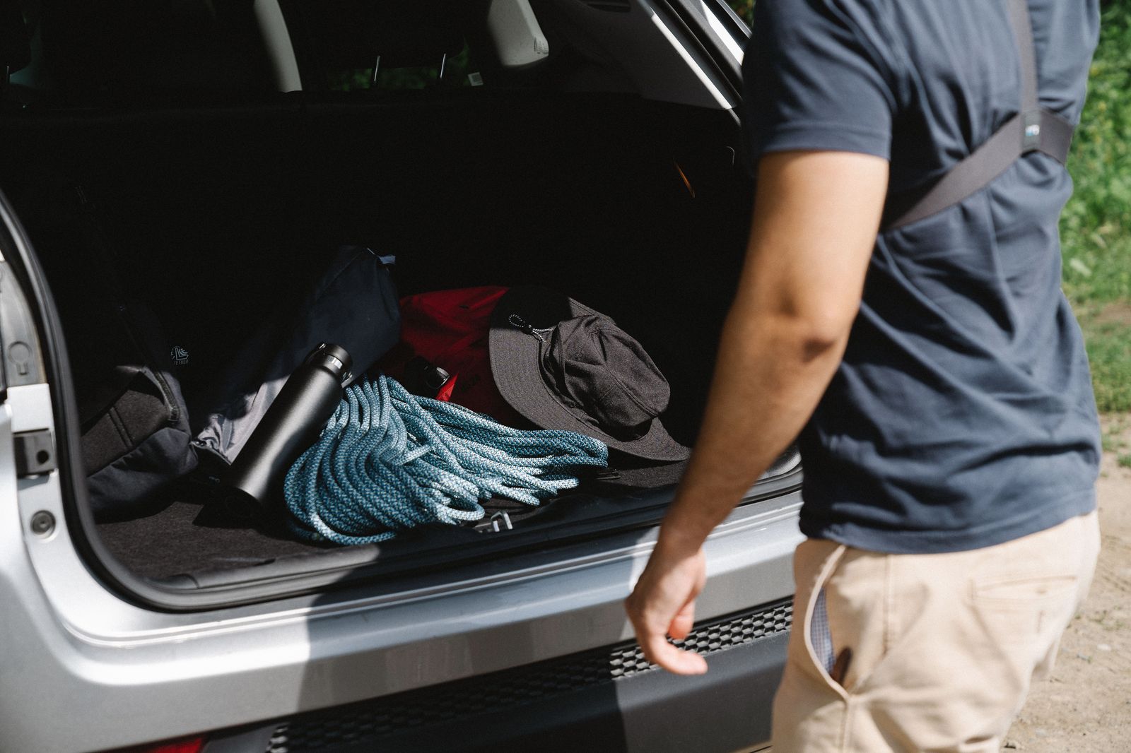 A family loading luggage into a car at the start of the drive from London to Pearson