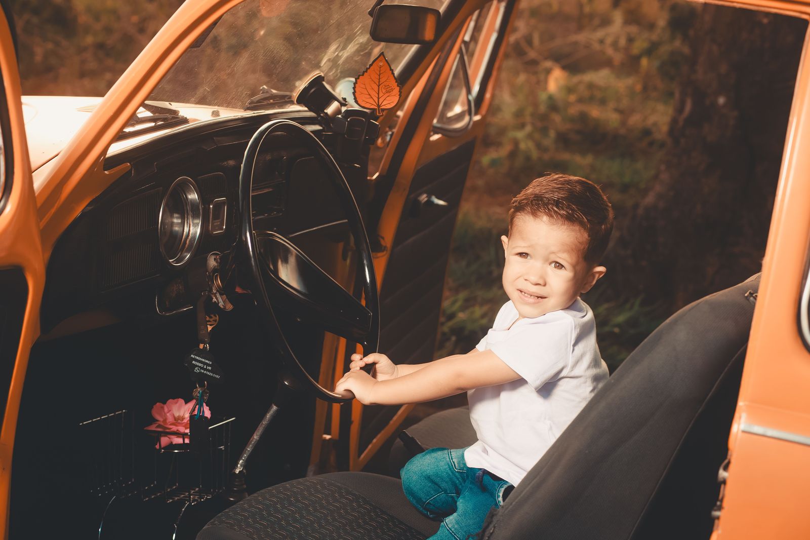 A child car seat fitted in the back of a vehicle before an airport pickup