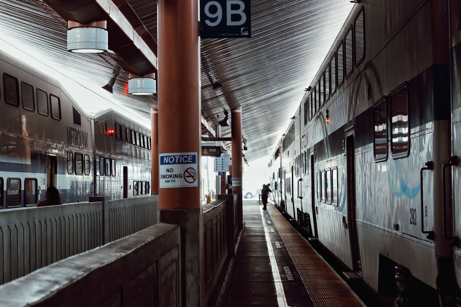 A quiet commuter train platform in the early morning, the GO option for light travellers