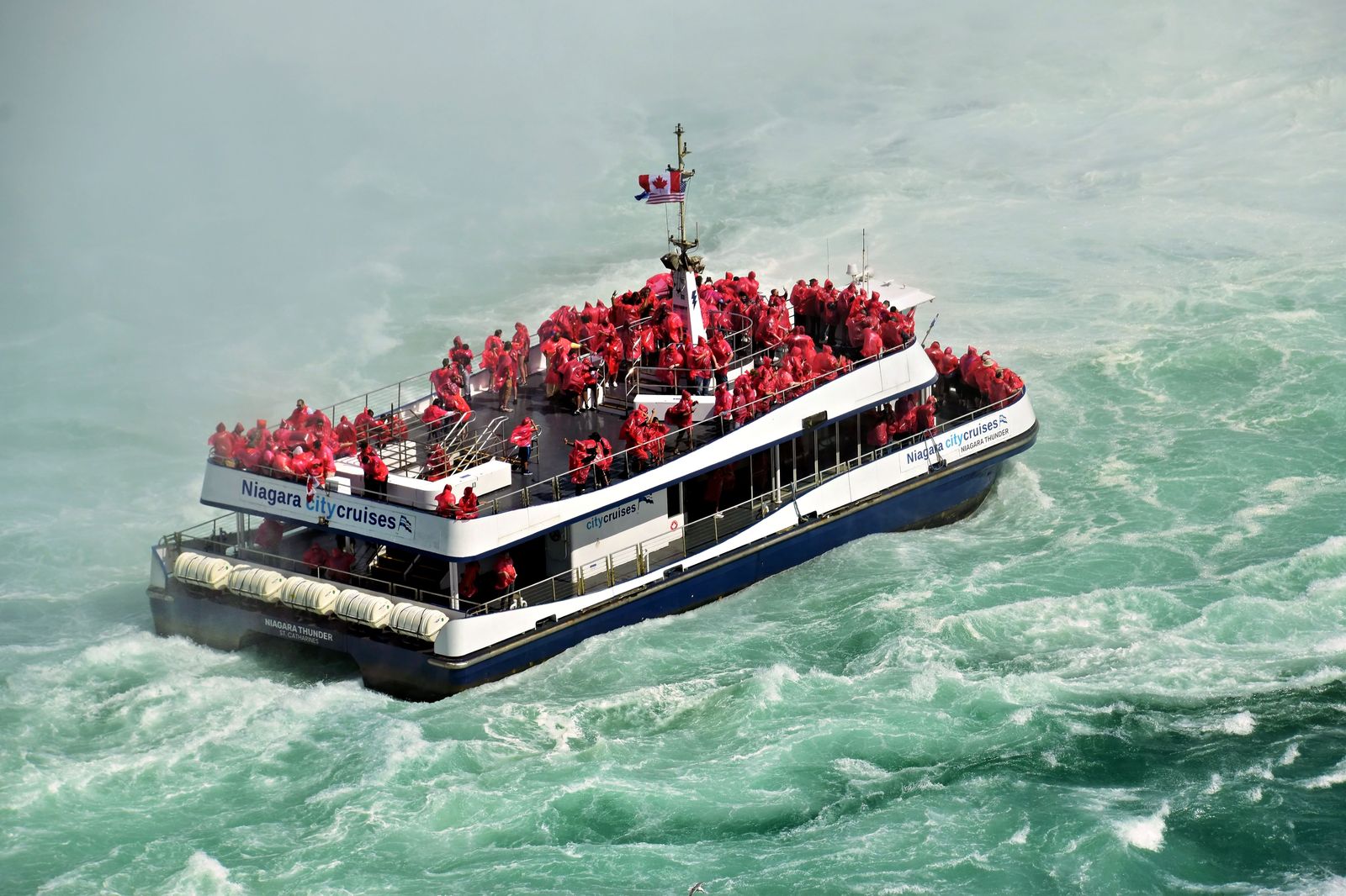 The boat tour heading into the mist below the falls, best done before the lunchtime crowds