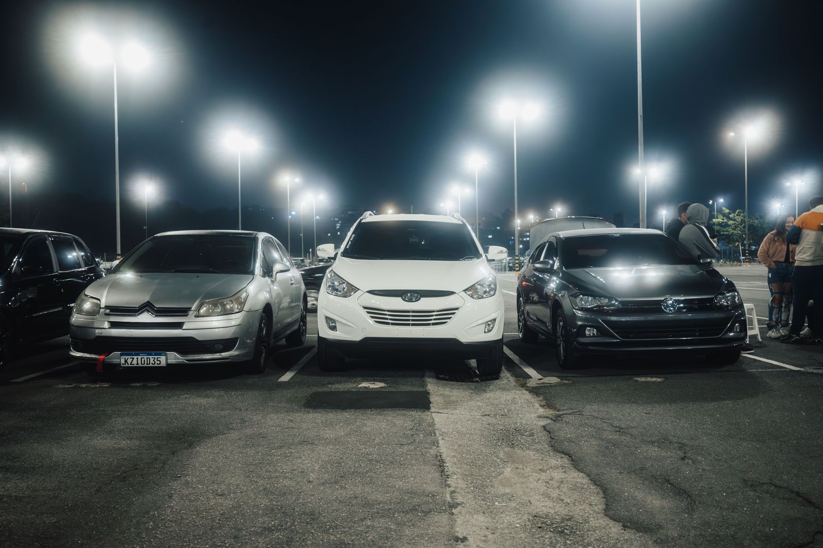 Rows of cars in a large airport parking lot, the alternative Oakville drivers compare against