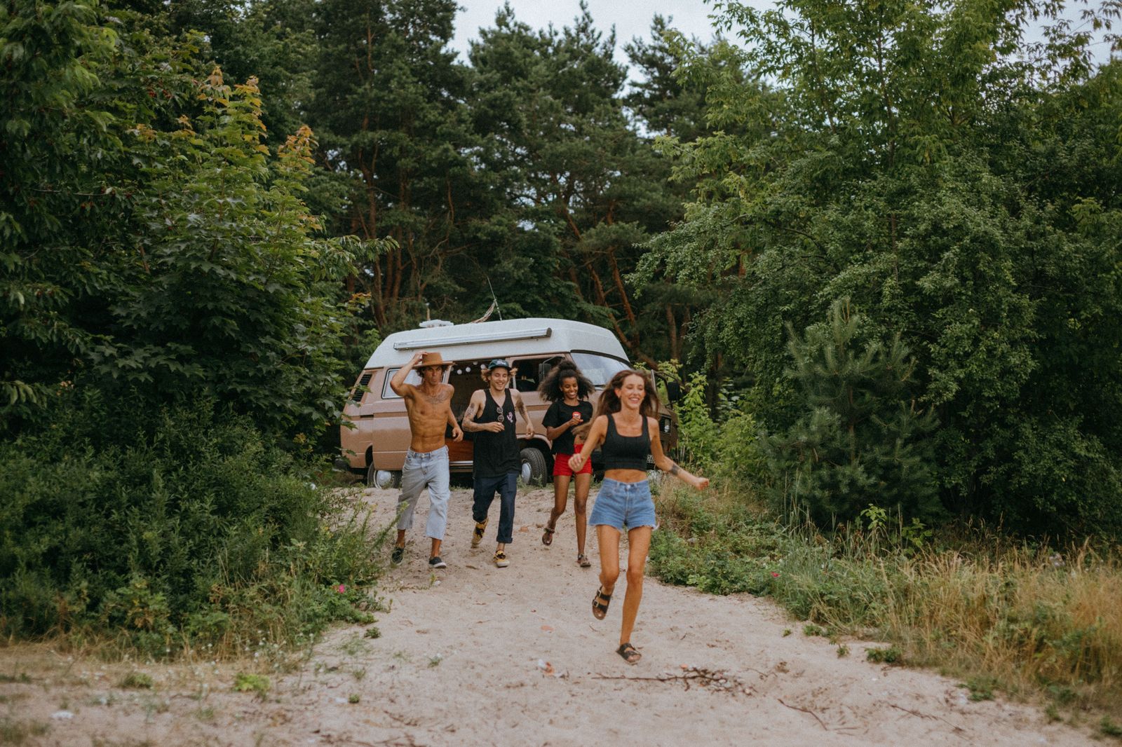 A group of travellers boarding a private Sprinter van with their luggage