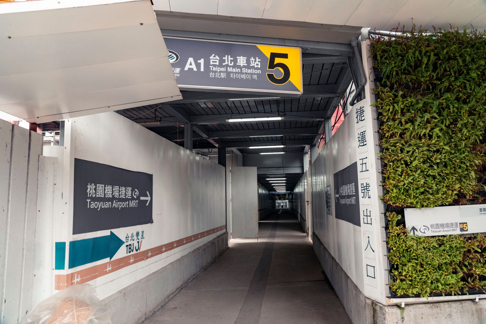 Connection signs above a corridor in an airport terminal