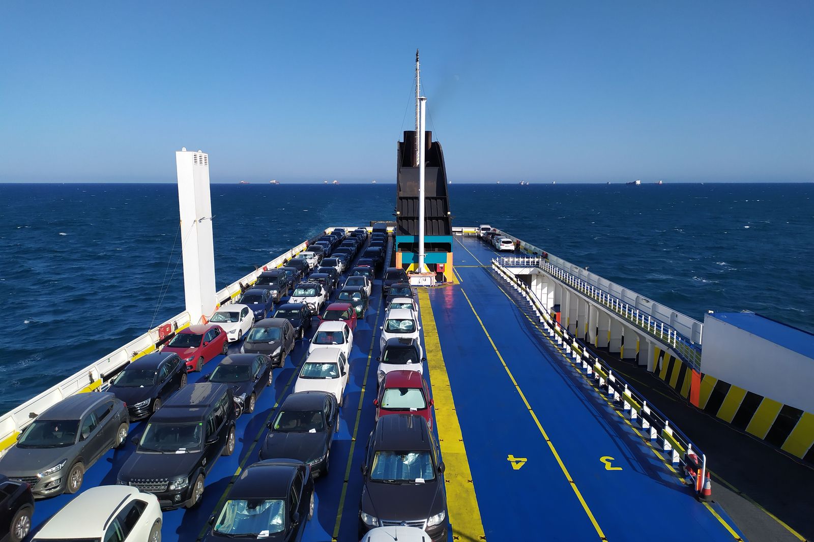 A small car ferry making a short crossing with vehicles on board