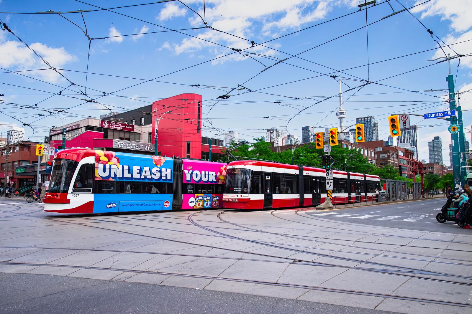 A streetcar running along Toronto's waterfront on a summer day