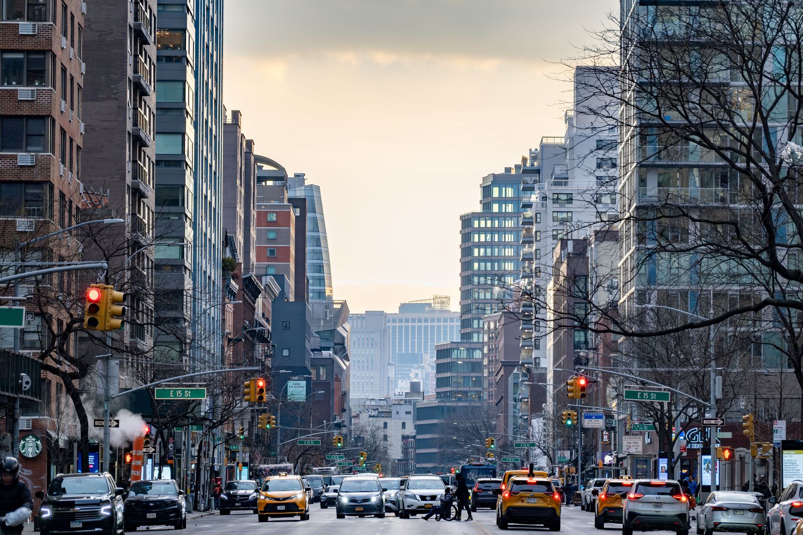 Yellow cabs on a Manhattan avenue at dusk