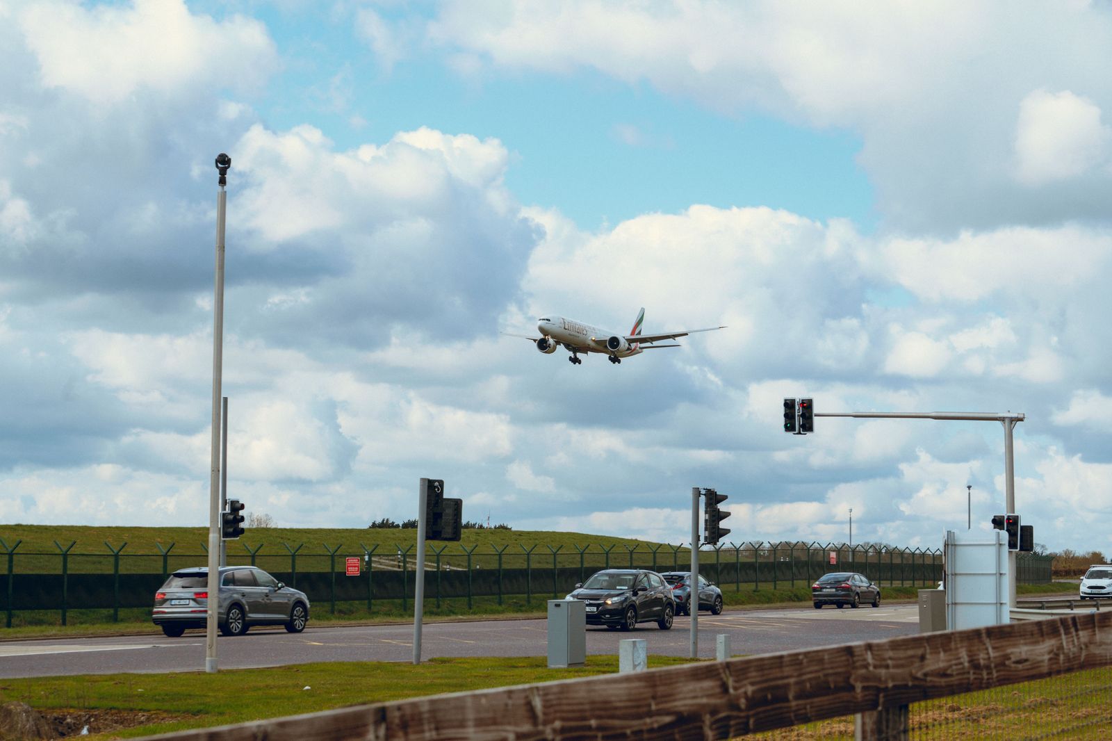 An aircraft on final approach over a highway beside Toronto Pearson, a familiar sight across north Etobicoke