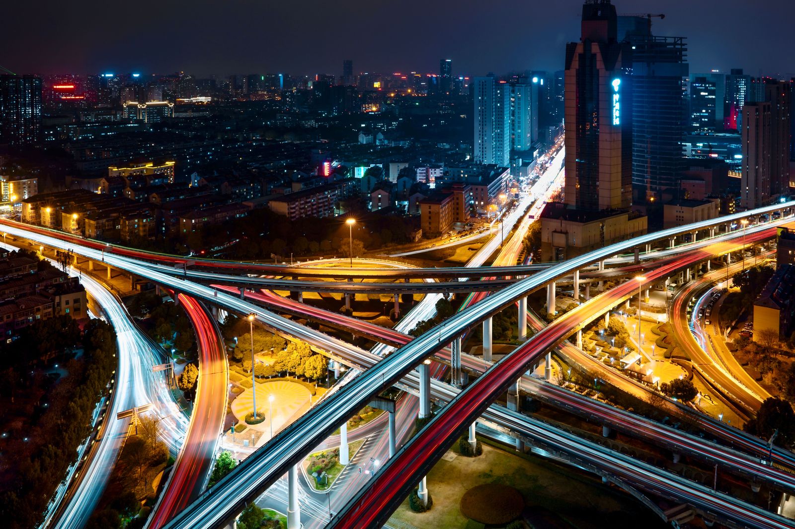 Evening traffic on a multi-lane Toronto highway interchange of the kind that decides North York airport times