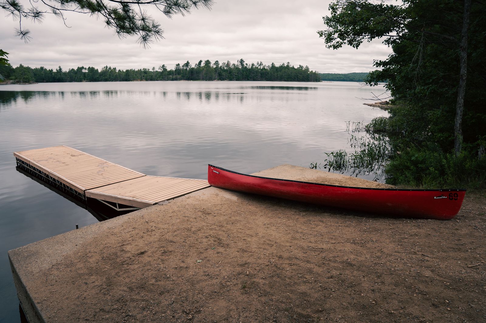 A canoe at a Kawarthas cottage dock, where many of our Peterborough-area airport runs begin