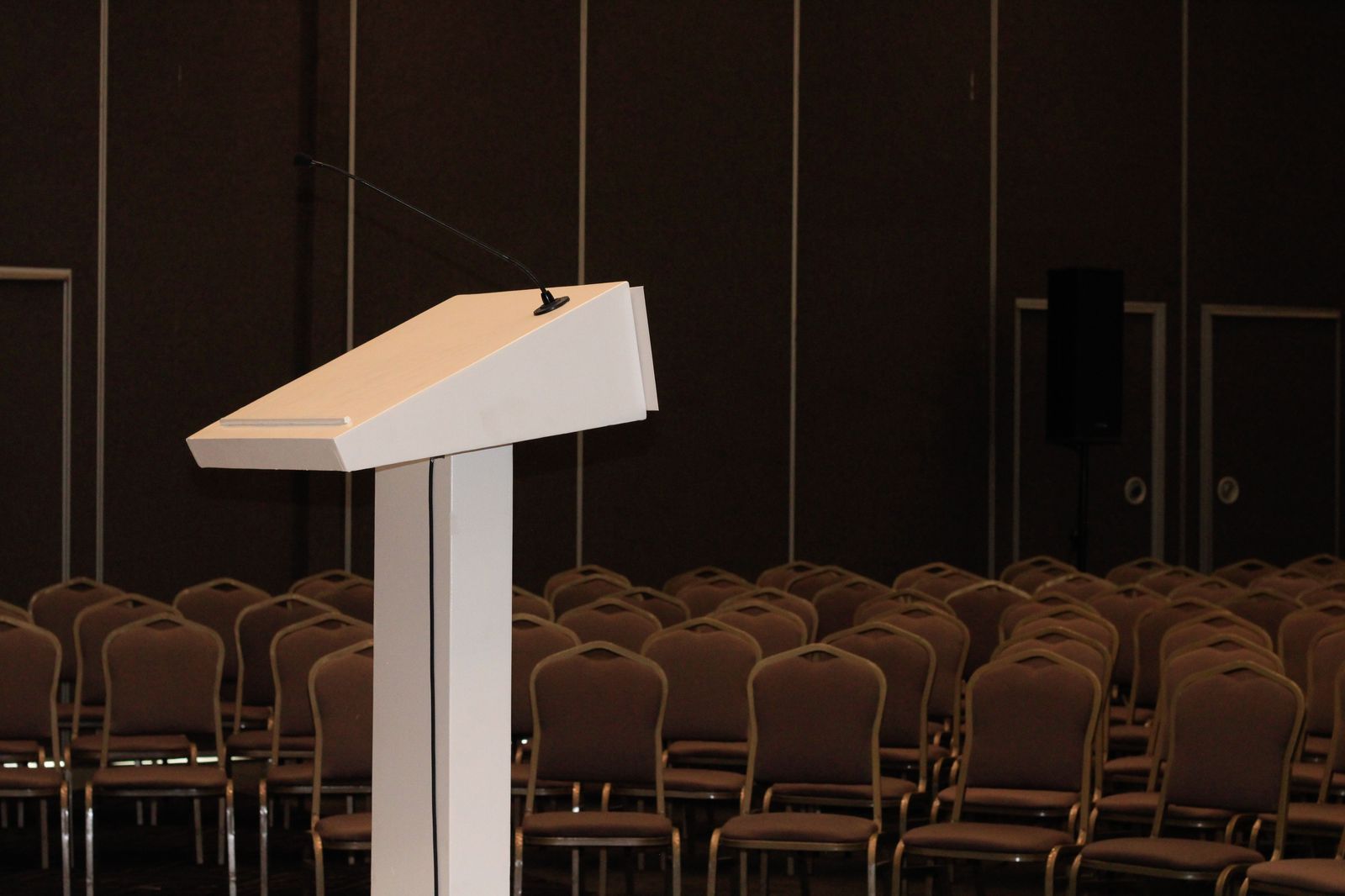 A conference hall filling up, the kind of event that needs a coordinated movement plan
