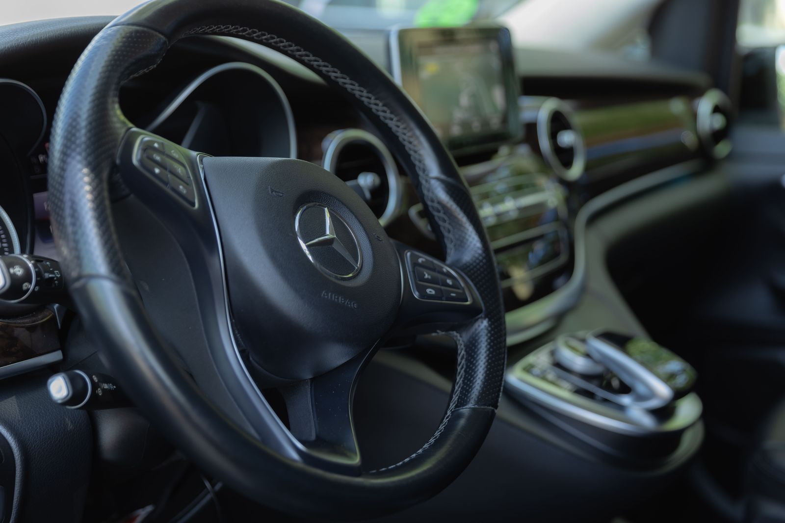 Inside an executive Sprinter: forward-facing leather seats and aisle access