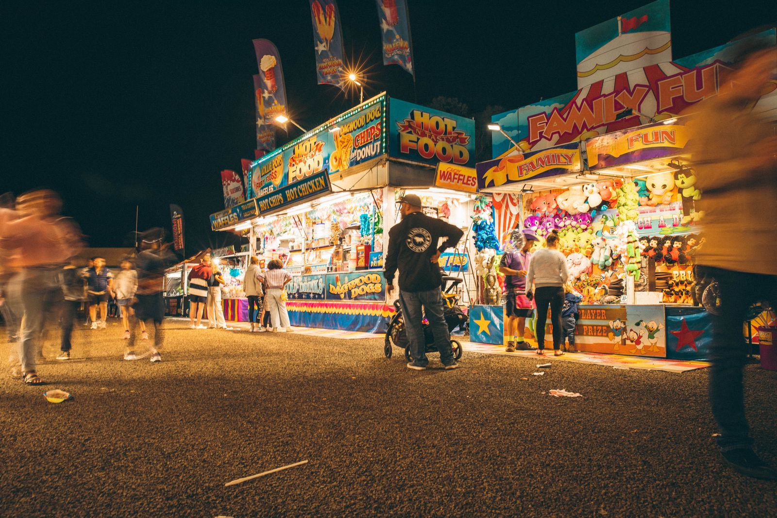 Food stalls and crowds on a summer evening at the Ex