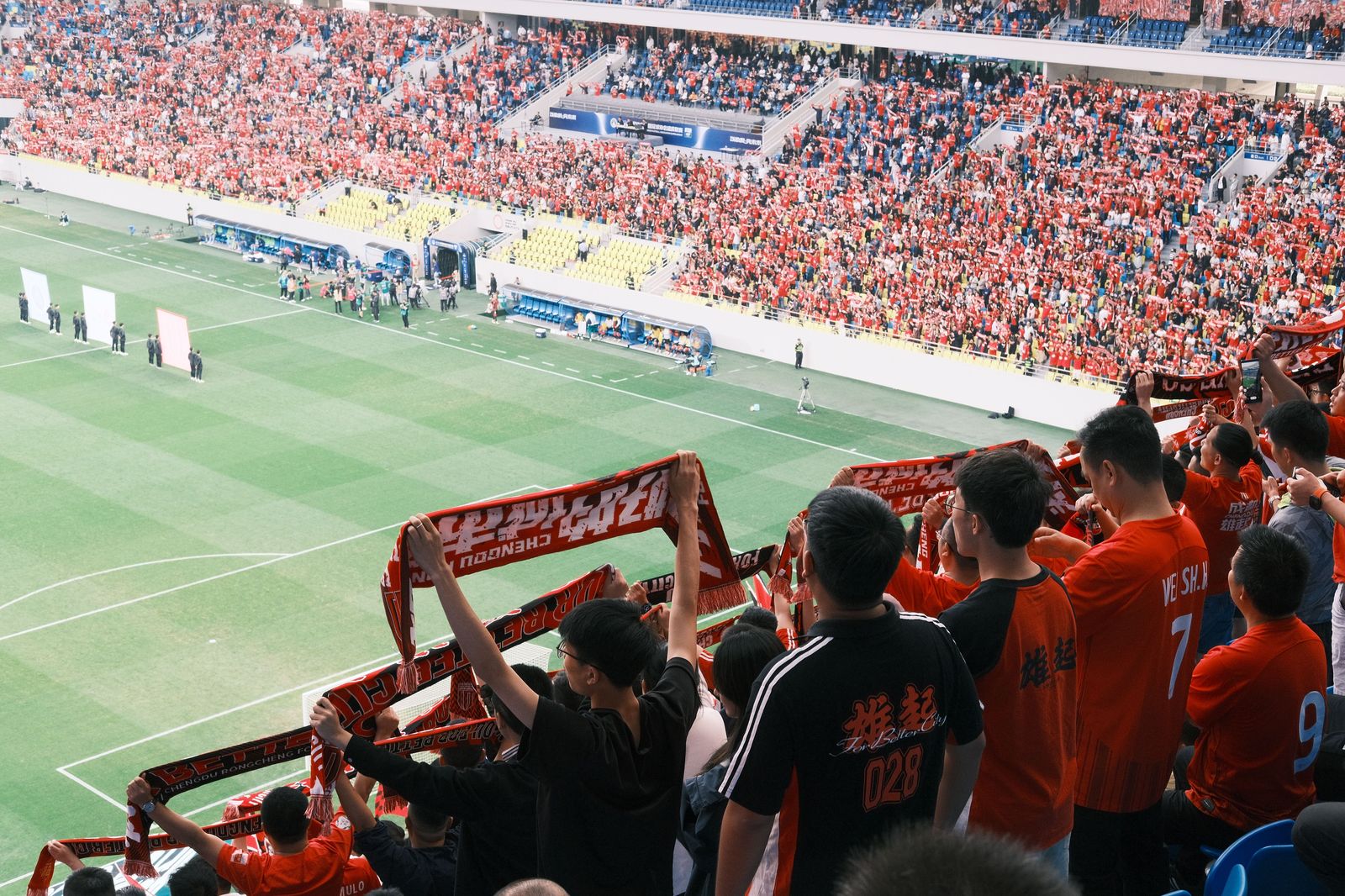 Match-day scarves at BMO Field: TFC and Argos crowds leave Exhibition Place on foot, by GO train and by car