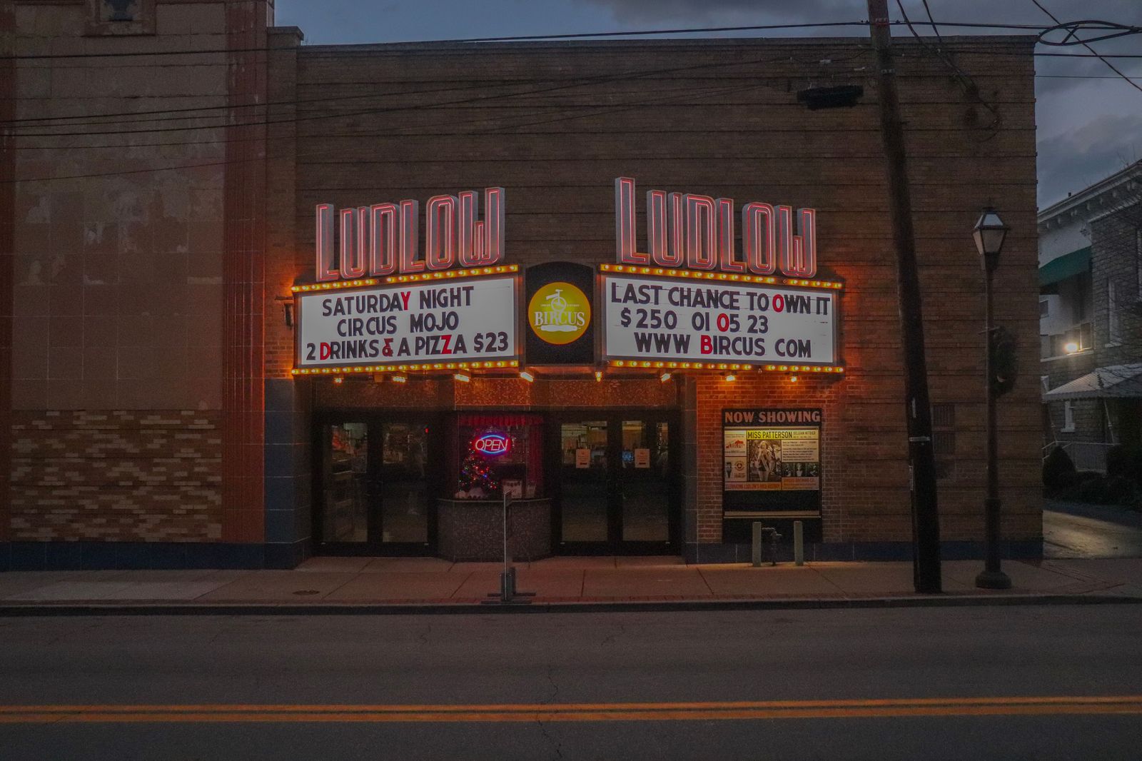 Theatre marquee lights on a busy show night downtown