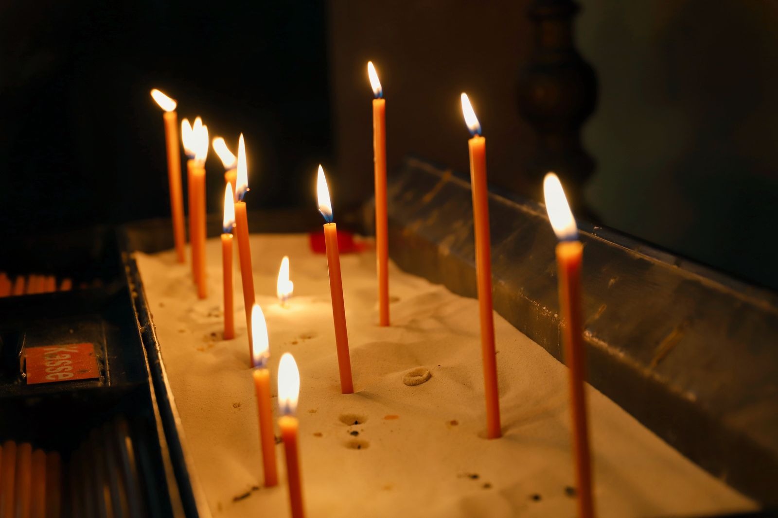 Candles lit inside a church ahead of a Christmas Eve service