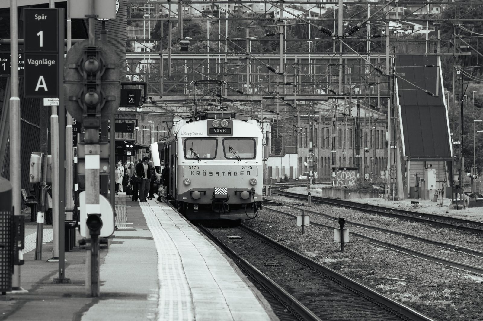Passenger train arriving at a suburban station platform