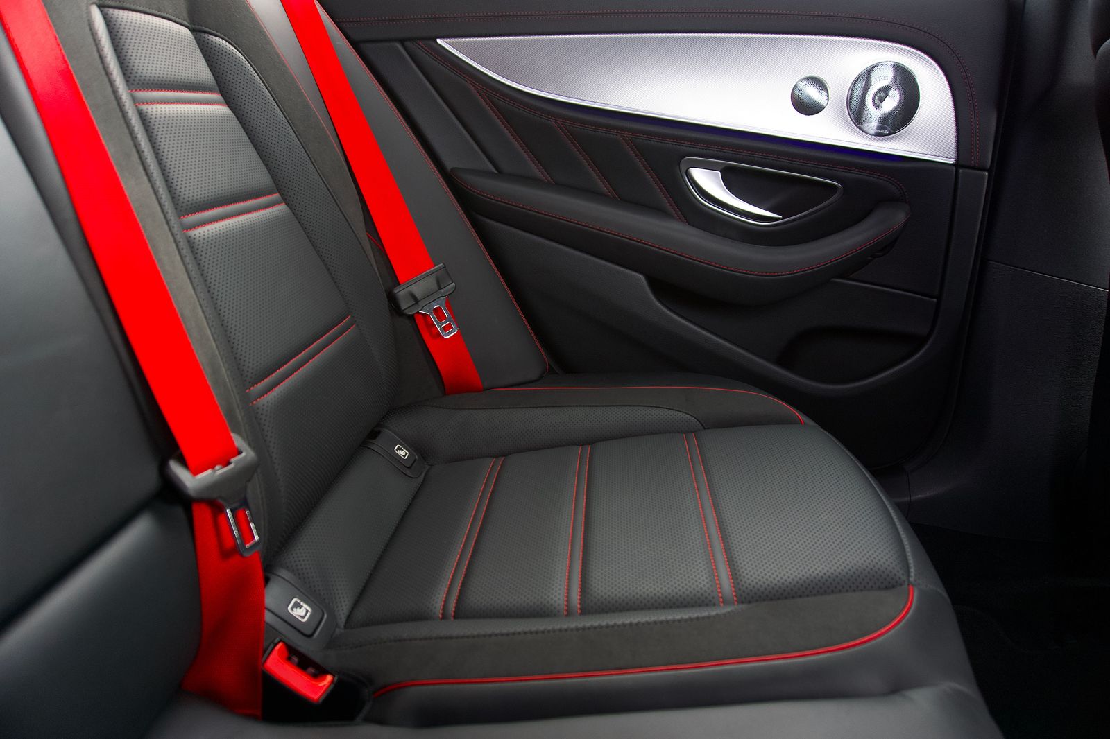 Rear seat of a black luxury car with leather upholstery