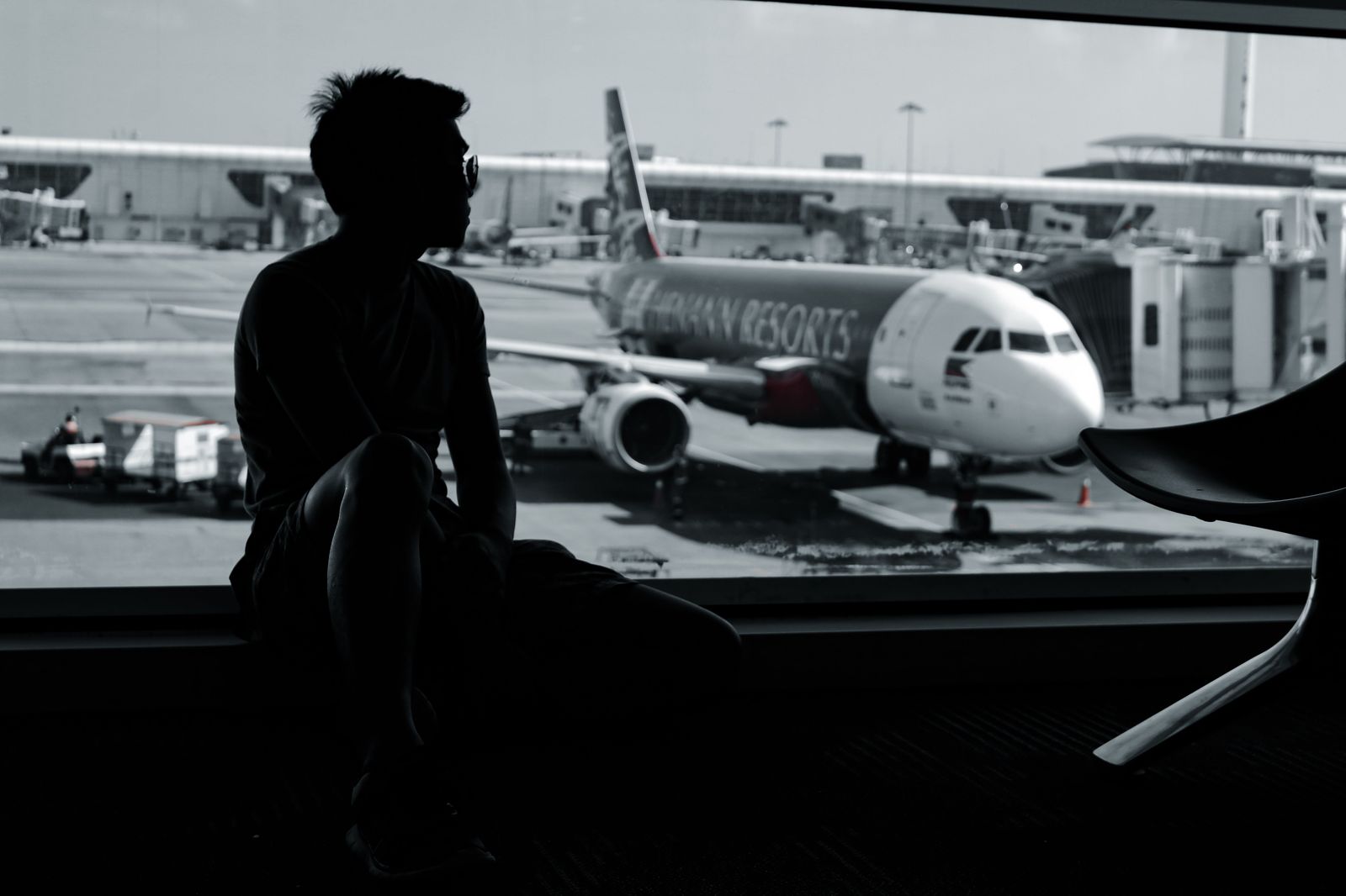 A traveller at the departures curb after a cross-border drive to the airport