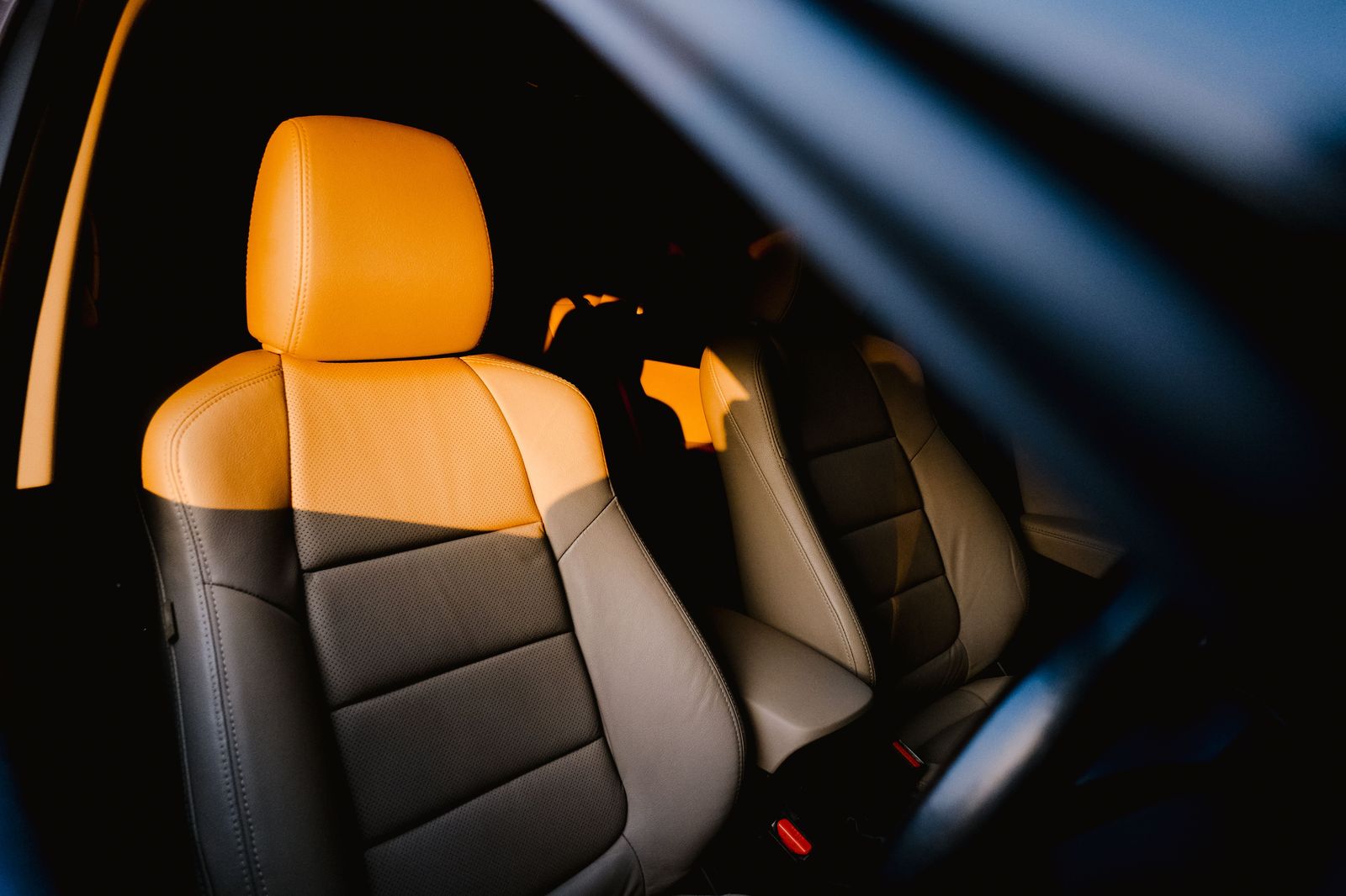 The rear cabin of a luxury car with leather seats