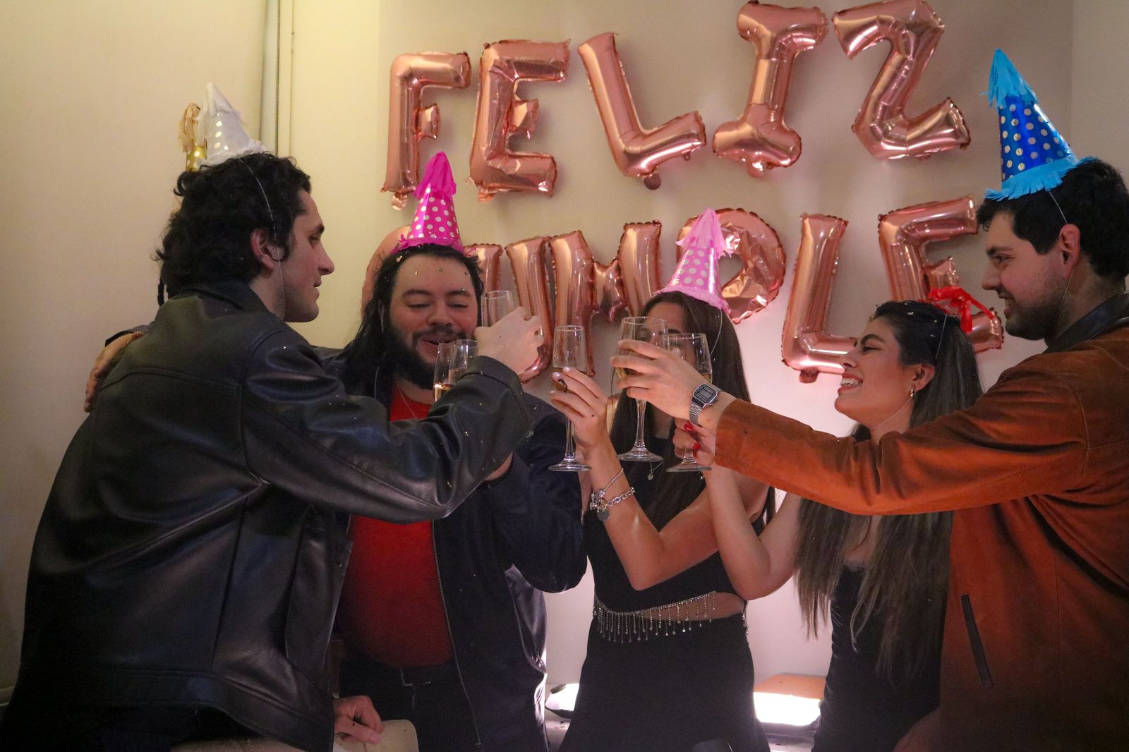 A group of friends in evening wear celebrating before a night out