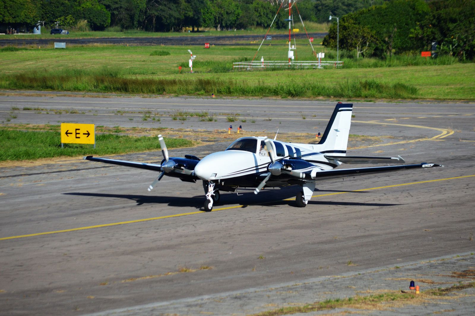 Turboprop airliner on a runway beside Lake Ontario